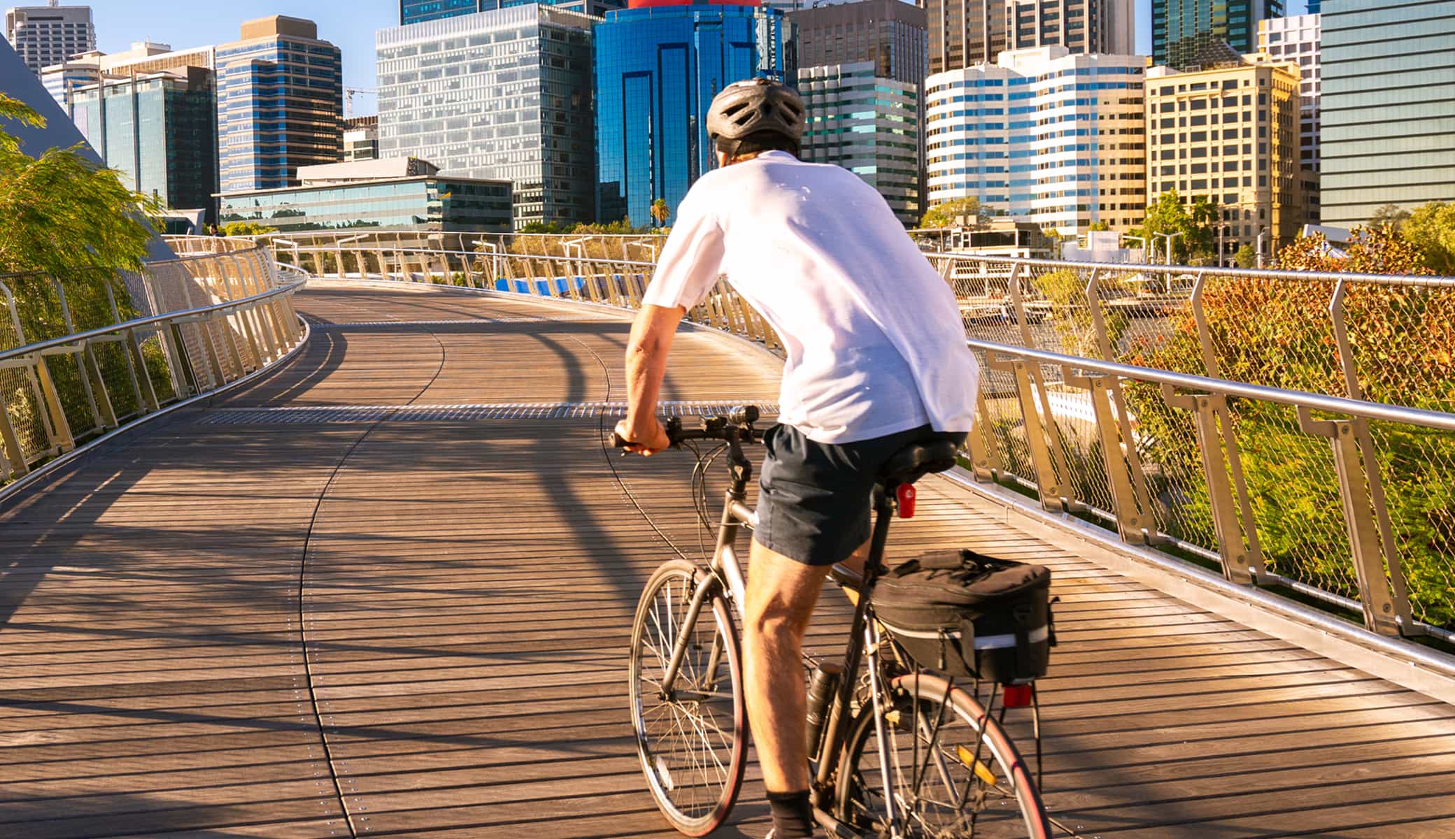 Cyclist on a bridge in the city