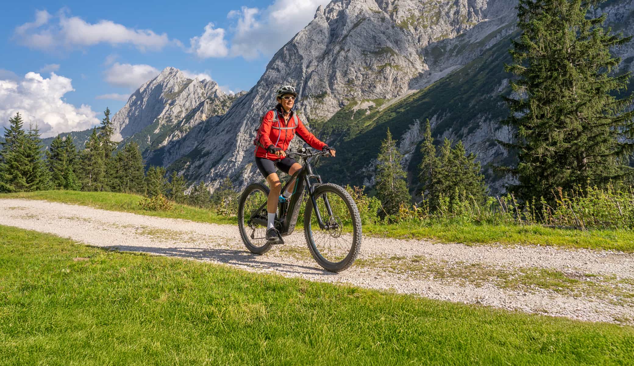 Woman on e-bike in the mountains