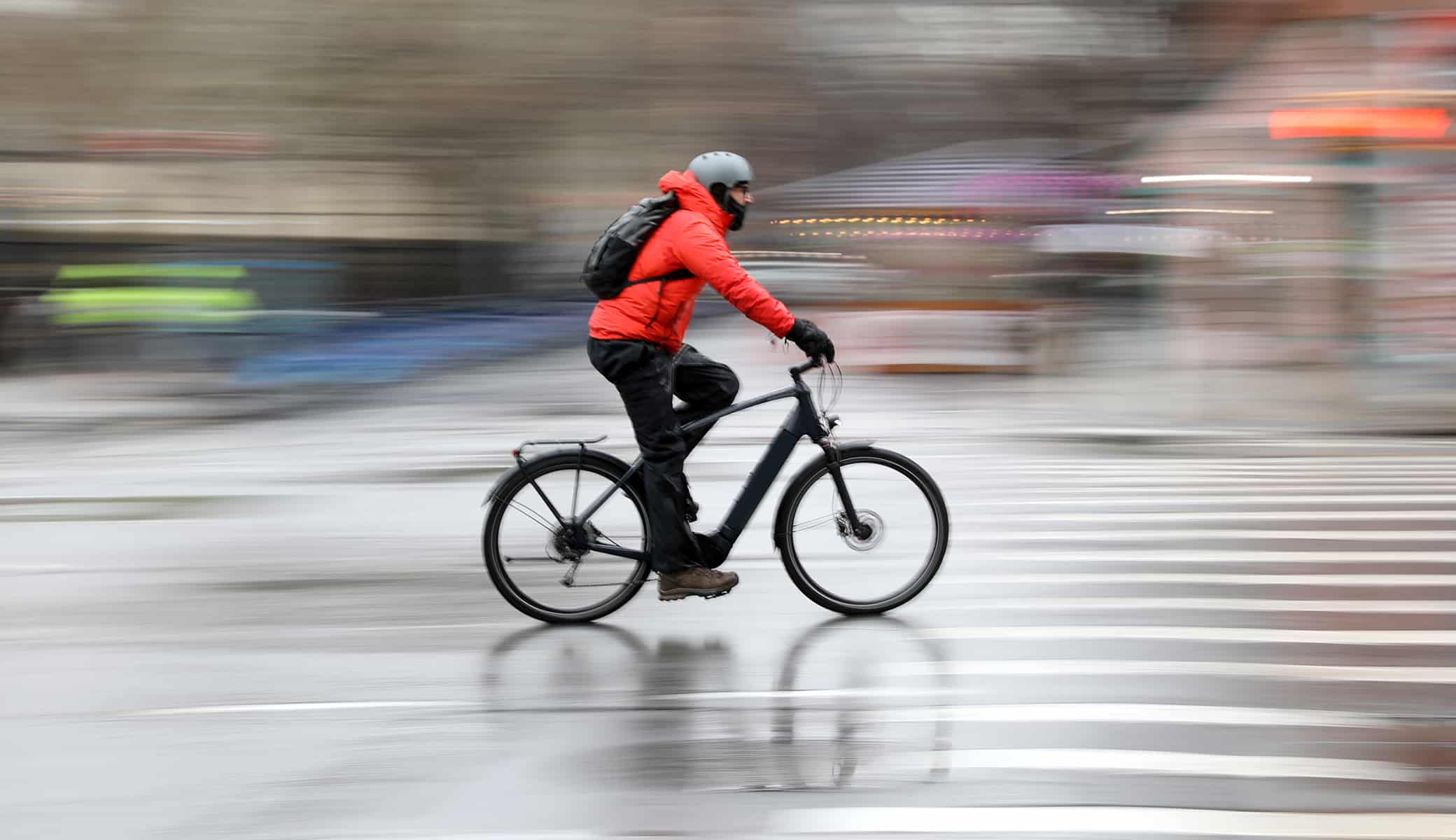 Cyclist riding fast through the city